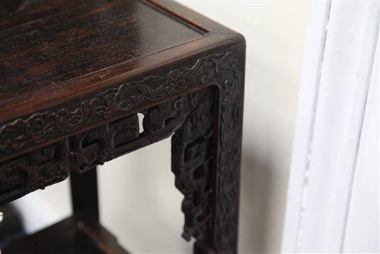 An early 20th century Chinese hardwood two tier occasional table, W.1ft 4in. D.1ft 1in. H.2ft 7in.